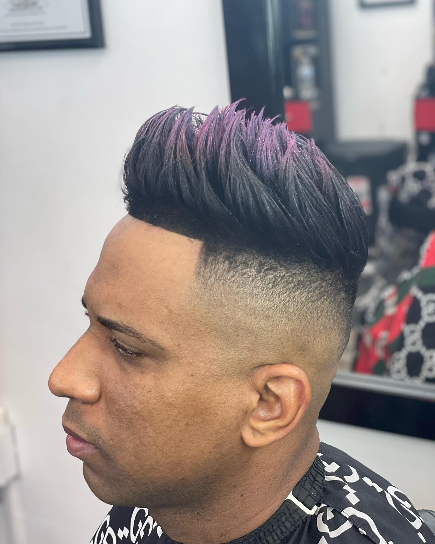 Slicked-back style with a low fade